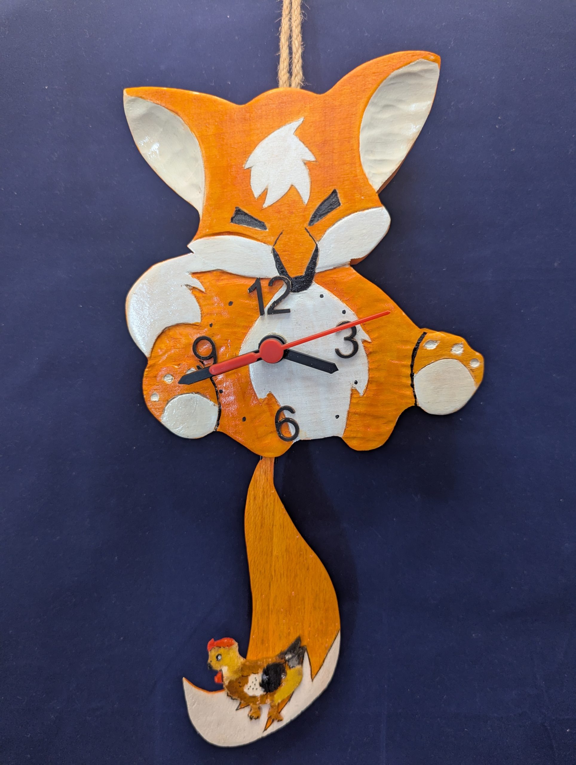 Horloge renard à balancier en bois